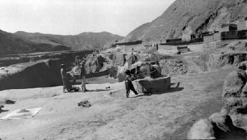 People working near mountains