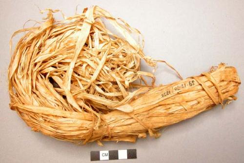 Raw fiber from inner bark of "genemo" tree. Used for making twine by +