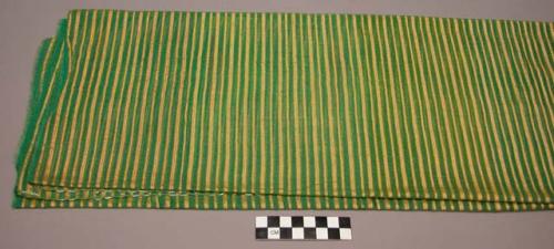 Green, yellow and white striped textile