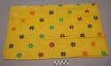 Bright yellow textile with colored woven designs