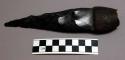 Knife of chipped obsidian with gum handle covered with clay and designs