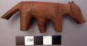 Carved wooden bottle stopper in form of cow (?), small hole through neck. L: 9 c
