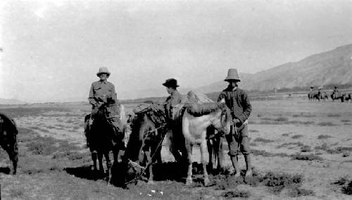 People on ponies in desert