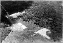 Air view of Chitchen Itza showing from left to right, Ball Court, El Castillo.