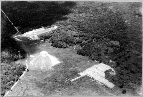 Air view of Chitchen Itza showing from left to right, Ball Court, El Castillo.