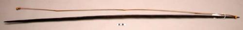 Dark wood bow with bamboo bowstring, white feather at one end (55")
