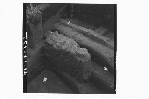 Fallen bits of debris of concrete over steps in sections N64-65.3E.  Mound 2-W.