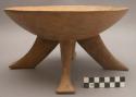 Four-legged wooden bowl