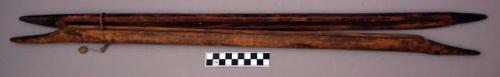 Loom, portion of, two carved wood dowels, grooved, ends pointed