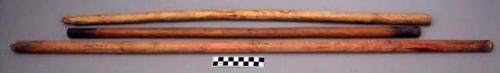 Loom, portion of, three carved wood dowels, one with burnt ends