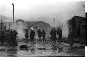 Men outside a smoking building