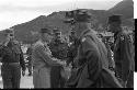 Two men in military uniform shaking hands