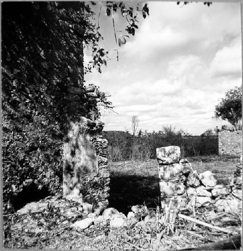 Doorway in atrio wall just north of Casa 2, Casa 2 to left, Casa 3 in background