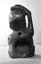 Wooden statuette from Dzab-na cave. - Rear view.