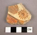 Potsherd showing flower