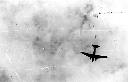 Paratroopers jumping out of airplane