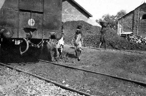 People near railroad tracks