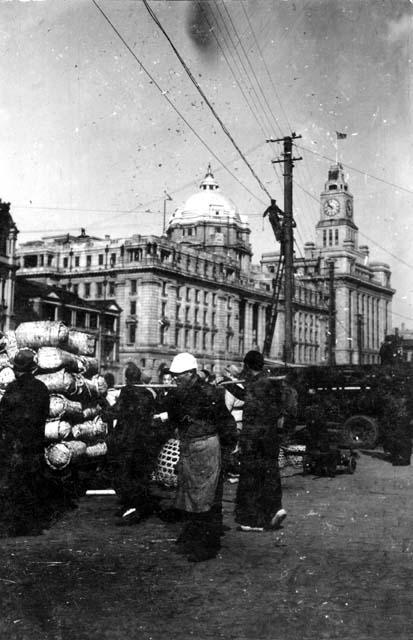 People in front of buildings