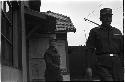 Men in uniform exiting a building