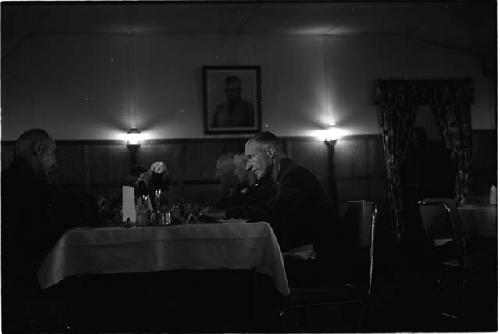 Men sitting at a table in a restaurant