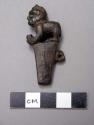 Wooden fragment of carved figure with turquoise bead eyes