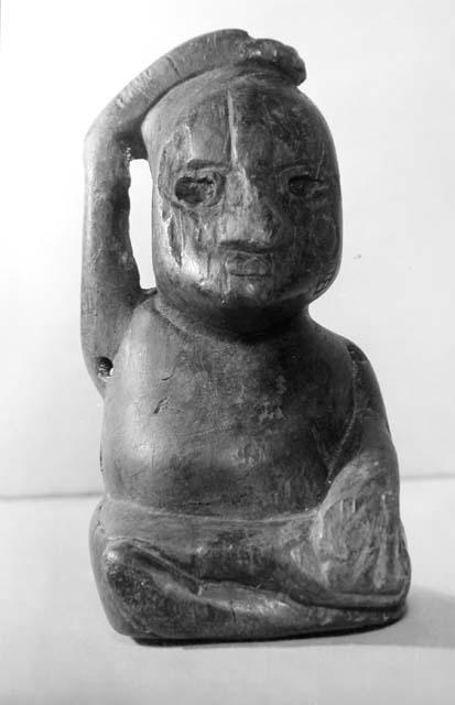 Wooden statuette from Dzab-na cave. - front view.