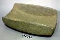 Metate. rectangular. very deep (12.0 cm.) open-ended trough metate. rounded bott