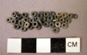 Ground stone beads, discoidal