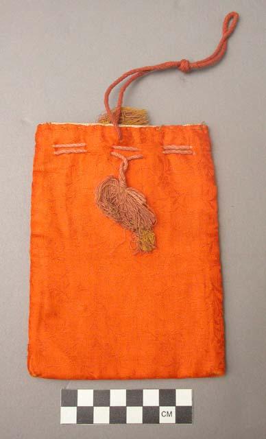 Small bag of orange chinese (?) silk brocade