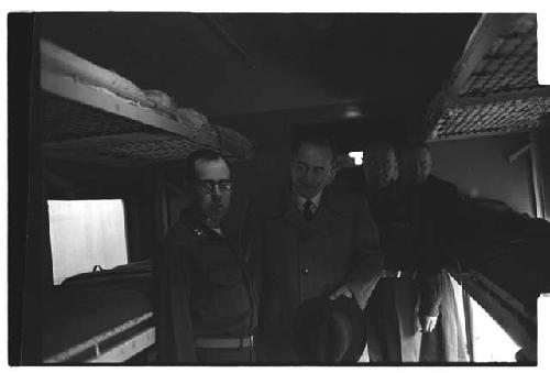 Colonel Slezak, Under Secretary of the Army, views bunks with American military personnel