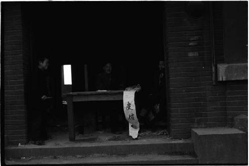 People sitting in building at a table