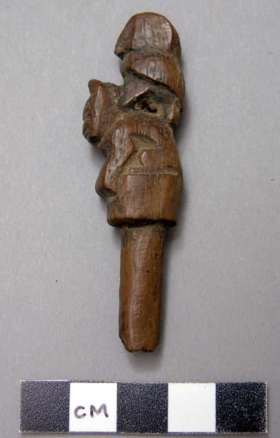 Wooden fragment - carved bird on a cat's back