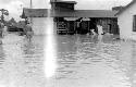 Men standing in flood