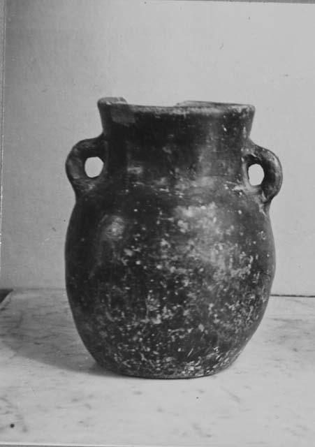 Pottery vessel with handles