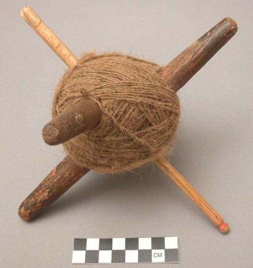 Wooden reel of brown wool