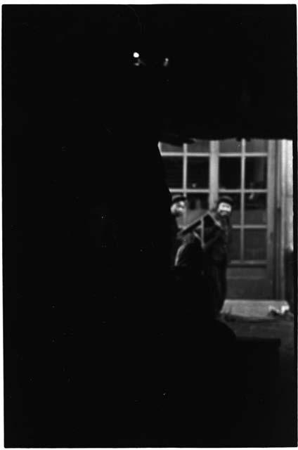 Two women in front of a window