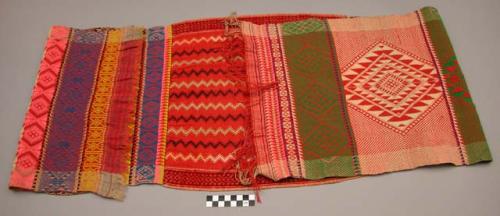 Textile; cotton, red; embroidered.