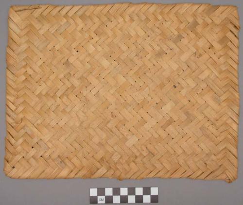 Mat made of narrower strips of bamboo than are used to make floor mats