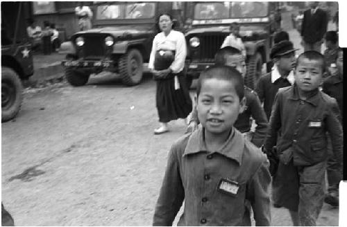 Group of children walking on a road