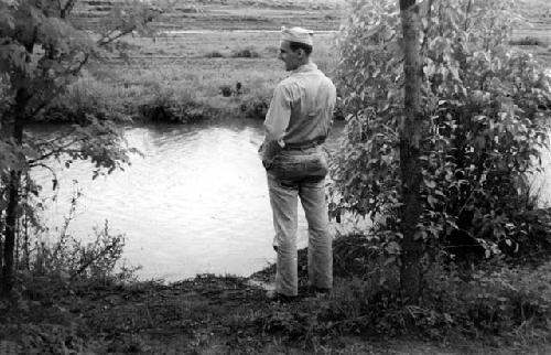 Soldier in front of water