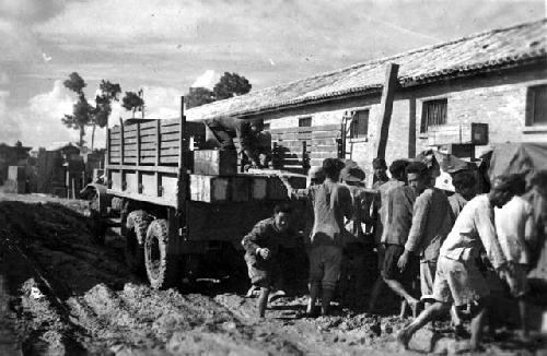 Men with truck in mud