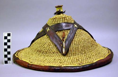 Straw hat with crossed leather design