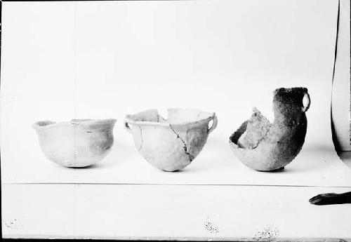 Three Pottery Vessels in Various States of Repair