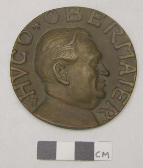 Metal medallion, bronze? with man's picture & words "Hugo Obermaier"