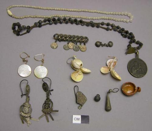 Shell, metal, and glass earrings, necklaces and a pin, various styles.