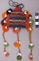 Woven multi-colored small purse with tassel and shell bead decoration