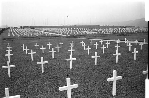 Cemetary with white crosses for gravemarkers