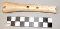 Bone flute with incisions on either end and 4 holes