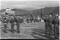 American flag being flown at parade