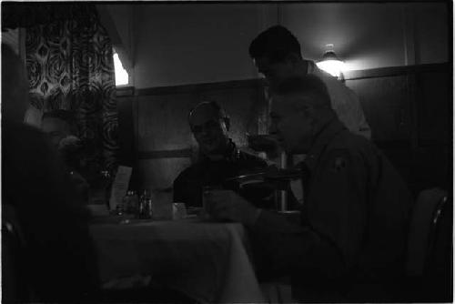 Men sitting at a table in a restaurant